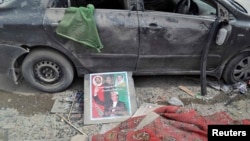 An election poster of the Pakistan Peoples Party lies on the ground after a bomb blast at a party campaign office in Quetta on May 10.