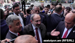 Prime Minister Nikol Pashinian visits protesters outside a court in Yerevan on May 20.