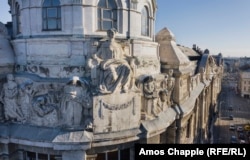 A limestone figure looks out over the Danube River from her perch on the corner of Hungary's Interior Ministry building.