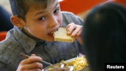 A child has a meal at an orphanage in the southern Russian city of Rostov-na-Donu.