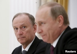 Russian Security Council Secretary Nikolai Patrushev (left) with Russian President Vladimir Putin (file photo)