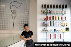 Afghan hairdresser Hussain, 19, poses for a picture at a hair salon in Kabul, Afghanistan.