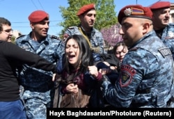 A demonstrator is detained by police in Yerevan on April 16.