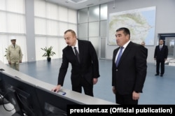 President Ilham Aliyev (left) launches the newly renovated Mingacevir hydroelectric power station in February 2017.