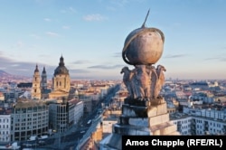 Birds of prey support a globe atop the Anker Palace, which was completed in 1910 for a Viennese insurance company.