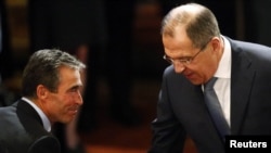 Russian Foreign Minister Sergei Lavrov (right) and NATO Secretary-General Anders Fogh Rasmussen meet at the 49th Conference on Security Policy in Munich on February 2.