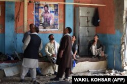 Afghan wrestlers gather at the gym the morning after the deadly suicide attack at the Maiwand club in Kabul on September 6.