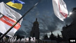 Flags of United Opposition wave above the crowd during their preelection meeting in front of St. Sophia Cathedral in Kyiv on October 26.