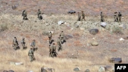 Pakistani troops climb a secured location on a hilltop post in Ladha, a town in Pakistan's troubled tribal region of South Waziristan along the Afghan border. (file photo)