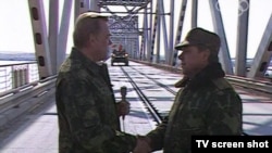 A screen grab from Russia's Channel One shows Mikhail Leshchinsky (left) with Soviet Army General Boris Gromov on February 15, 1989, at the Afghan-Soviet border.