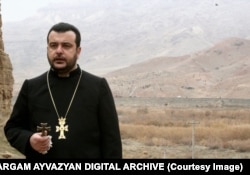 Bishop Topouzian offers a tearful requiem from Iranian soil as the destruction of the Julfa cemetery takes place in Azerbaijani territory in the background. The bishop died in 2010.