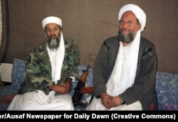 Osama bin Laden (left) is seen with adviser Ayman al-Zawahri during a 2001 interview. This is one of several photos in which the Al-Qaeda leader is seen with an AKS-74U.