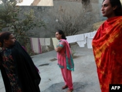 Pakistani hijras stand in the courtyard of their joint house in Rawalpindi.