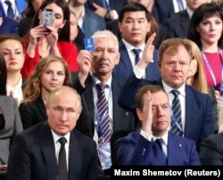 Russian President Vladimir Putin (front left) and Prime Minister Dmitry Medvedev attend a United Russia convention in Moscow in December.