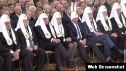 A doctored photograph of Putin's state of the union address tweeted by Uborshchitsa "Lenta.ru" shows the Kremlin elite in Orthodox vestments -- and Prime Minister Dmitry Medvedev, who at times appeared to be asleep -- wearing bunny ears.