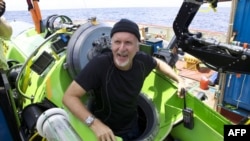 U.S. film director James Cameron emerges from "Deepsea Challenger" after journeying to the bottom of the Pacific Ocean in March.