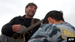 Russian rock singer Yury Shevchuk performs at a protest rally in central Moscow.