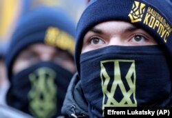 Members of the National Militia attend a rally in front of the Ukrainian president's office in Kyiv on December 7.