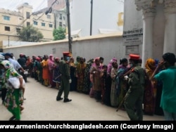 Dhaka locals lining up for food being handed out at the Armenian Church in 2020.