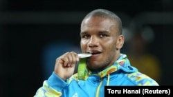 Zhan Belenyuk poses with the Olympic medal he won for Ukraine in Rio de Janeiro in 2016.