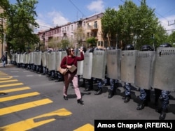 An Armenian woman confronts a line of riot police blocking Yerevan's Mashtots avenue: "I'm a journalist but before I'm a journalist I'm a citizen, and before you are police you are all citizens of Armenia!"