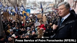 Petro Poroshenko talks to supporters in front of a court in Kyiv prior to proceedings on charges of high treason against the former president, which began earlier this year.