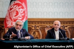 Afghan President Ashraf Ghani (right) and his main political rival, Chief Executive Abdullah Abdullah.