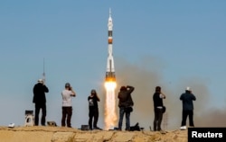 A Soyuz MS-10 spacecraft blasts off to the ISS from the Baikonur Cosmodrome in October 2018.