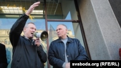 Uladzimer Nyaklyaeu (left) and Mikalay Statkevich speak at a rally in Minsk in September 2015.