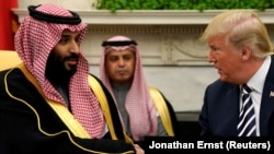 U.S. President Donald Trump shakes hands with Saudi Arabia's Crown Prince Muhammad bin Salman in the Oval Office, March 2018