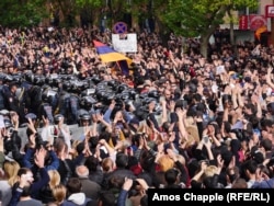 Protesters gather outside a police station in Yerevan on April 22.