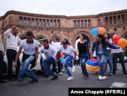 Balloons and dancing as crowds on Republic Square await word of the vote.