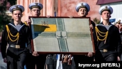 A naval flag that was made in 1918 featuring the trident (top left) that is now being used as a national symbol for Ukraine.