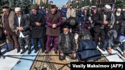 Ingush protesters pray during a rally against the new land swap deal between Ingushetia and Chechnya in Magas in October 2018.