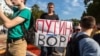 A protester holds a sign reading "Putin Is A Thief" during a rally against raising the retirement age, in Samara on September 9.