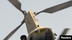 A U.S. Air Force CH-47 Chinook helicopter takes off from Camp Nathan Smith in Kandahar City on May 11.