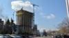 Is the uncompleted tower the symbol of a "golden age" -- or political corruption?