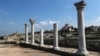 The ruins of an ancient basilica (foreground) and the St. Vladimir Cathedral (background) are seen at the Tauric Chersonesos preserve in Sevastopol in 2017.