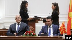 Macedonian Prime Minister Zoran Zaev (right) and his Bulgarian counterpart, Boyko Borisov, attend the friendship treaty signing ceremony in Skopje on August 1.