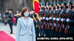 Maia Sandu reviews the honor guard in front of the presidential building after her inauguration ceremony i​n Chisinau, Moldova.