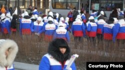 Supporters of presidential candidate Vladimir Putin rally in Vladivostok on February 18.