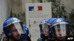 Turkish riot police stand guard in front of a French diplomatic facility in Istanbul as Turks rally after the French lower house approved a bill on December 22 to criminalize the denial of recognized genocides.