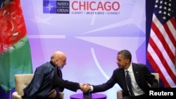 U.S. President Barack Obama (right) hosts a meeting with Afghan President Hamid Karzai during the NATO Summit at McCormick Place in Chicago on May 20.