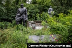 Poliske, Ukraine. A simple dedication on this overgrown memorial reads: “1941-1945. We remember.”