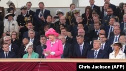 Queen Elizabeth II (center) speaks from the royal box during an event to commemorate the 75th anniversary of the D-Day landings in Portsmouth on June 5.