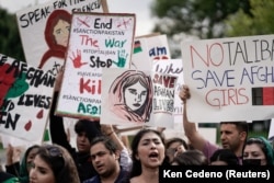 Demonstrators gather in front of the White House in Washington on August 15, as Taliban insurgents entered Kabul.