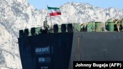 An Iranian flag flutters on board the Adrian Darya 1 off the coast of Gibraltar on August 18.