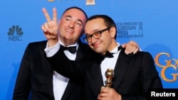 Leviathan producer Alexander Rodnyansky (left) and director Andrey Zvyagintsev pose for reporters after winning a Golden Globe for Best Foreign Language Film om January 11.