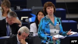 European Union foreign-policy chief Catherine Ashton (right) addresses members of the European Parliament as part of a plenary session in Strasbourg on September 11.