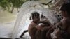 Pakistani boys cool off in a canal amid sweltering heat in Karachi. (file photo)